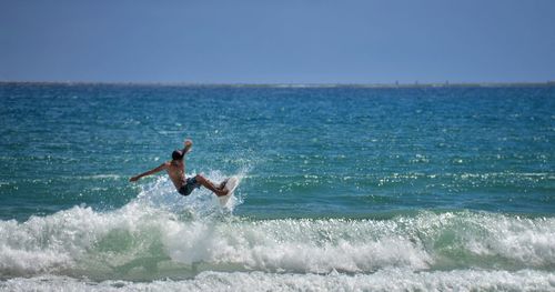 Man surfing on sea