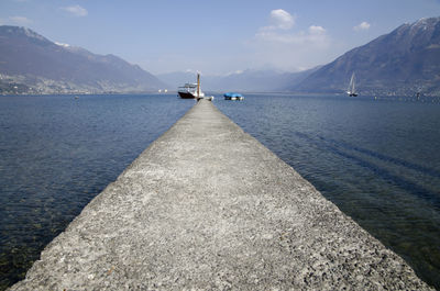 Pier on lake maggiore against sky