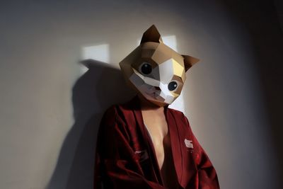 Close-up of mask against wall