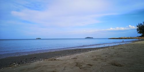 Scenic view of beach against sky