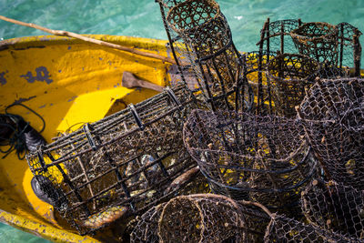 Rusty fish traps on the boat with the crystal clear water in the background in semporna, sabah.