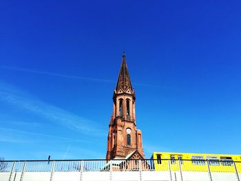 High section of built structure against clear blue sky