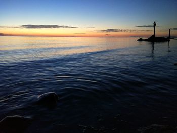 Scenic view of sea against sky at sunset