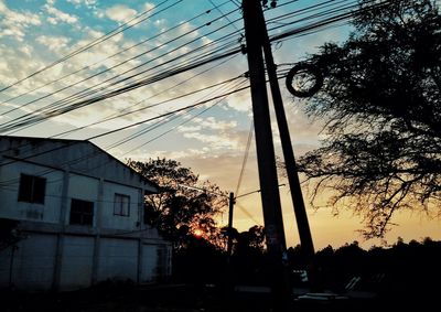 Low angle view of electricity pylon against sky