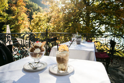 Table, dessert ice cream and chairs in restaurant