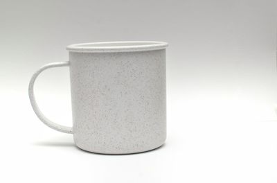 Close-up of coffee cup against white background