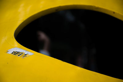 Close-up of yellow man in car