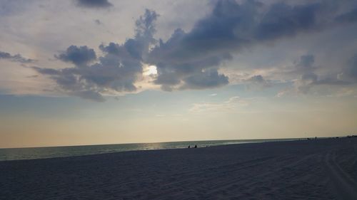 Scenic view of beach against sky during sunset