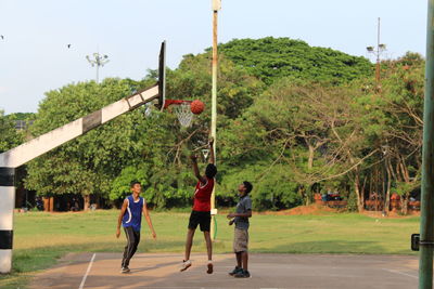 People playing basketball court