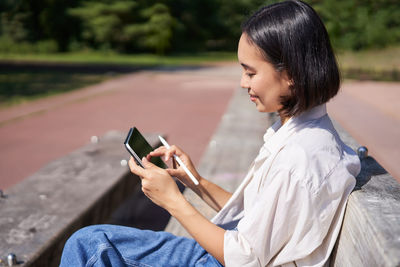 Young woman using mobile phone