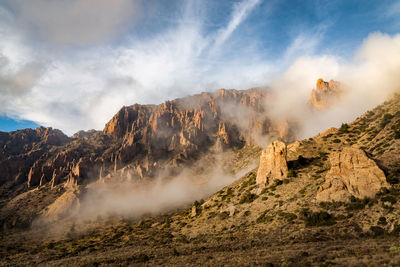 Panoramic view of sun shining over land