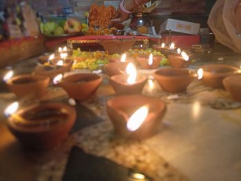 Close-up of illuminated candles burning
