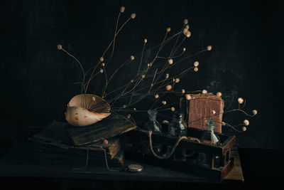 Close-up of objects on table in darkroom