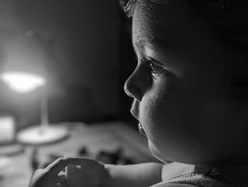 Side view of boy playing piano