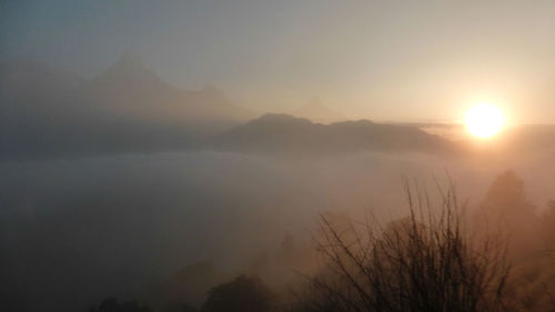 Scenic view of silhouette mountains against sky during sunset