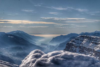 Scenic view of snowcapped mountains against sky