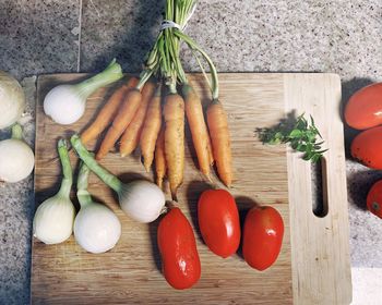 High angle view of vegetables on cutting board