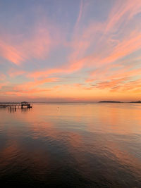 Sea against romantic sky at sunset 