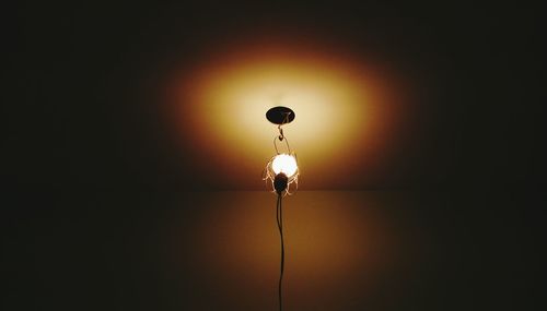 Low angle view of lit lamp