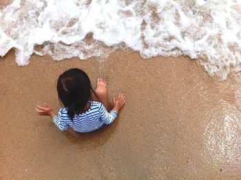Boy playing at beach