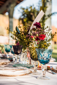 Flower vase on table in restaurant