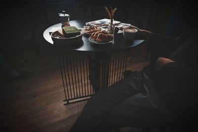 High angle view of man having food on table