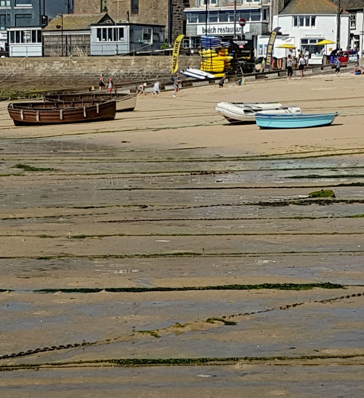 BOAT MOORED AT HARBOR