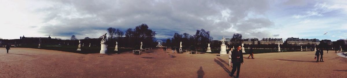 Silhouette of woman against cloudy sky