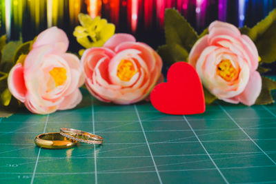 Close-up of multi colored flowers on table