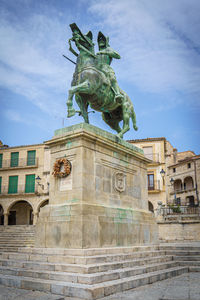 Low angle view of statue against sky