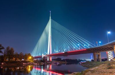 View of suspension bridge at night