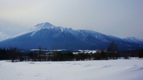 Scenic view of snow covered mountains