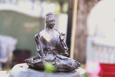 Close-up of statue against blurred background