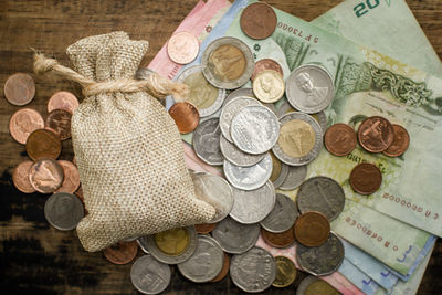 High angle view of coins on table