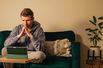 Young woman using laptop at home