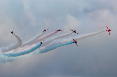 Low angle view of airplane flying in sky