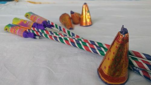 Close-up of multi colored bottles on table