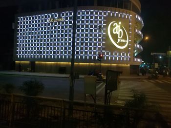 Illuminated road sign at night