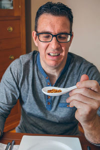 Man looking at worms at restaurant