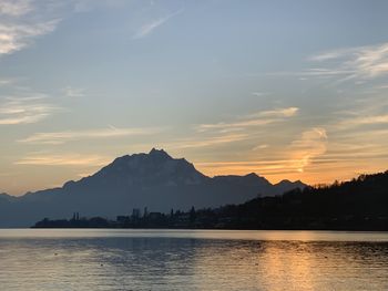 Scenic view of lake against sky during sunset