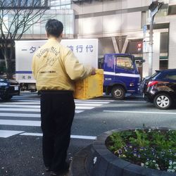 Woman standing on city street