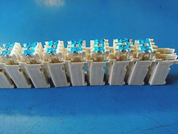 Close-up of coins on table against blue background