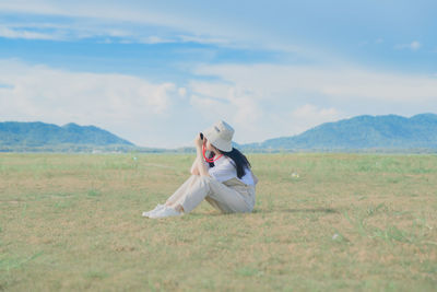 Full length of man on field against sky