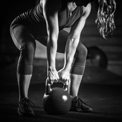 Young woman exercising at gym