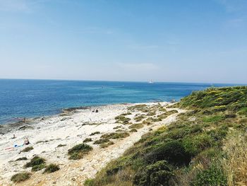 Scenic view of sea against blue sky