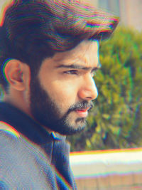 Portrait of young man looking away