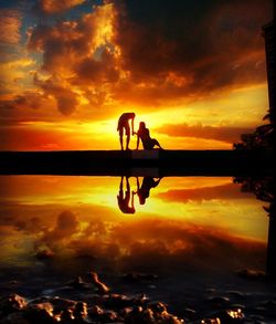Silhouette of people at sunset