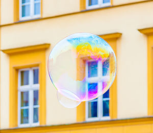 Close-up of bubbles against building