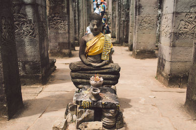 Statue of buddha against building