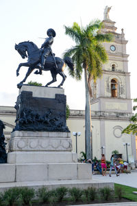 Statue in front of building